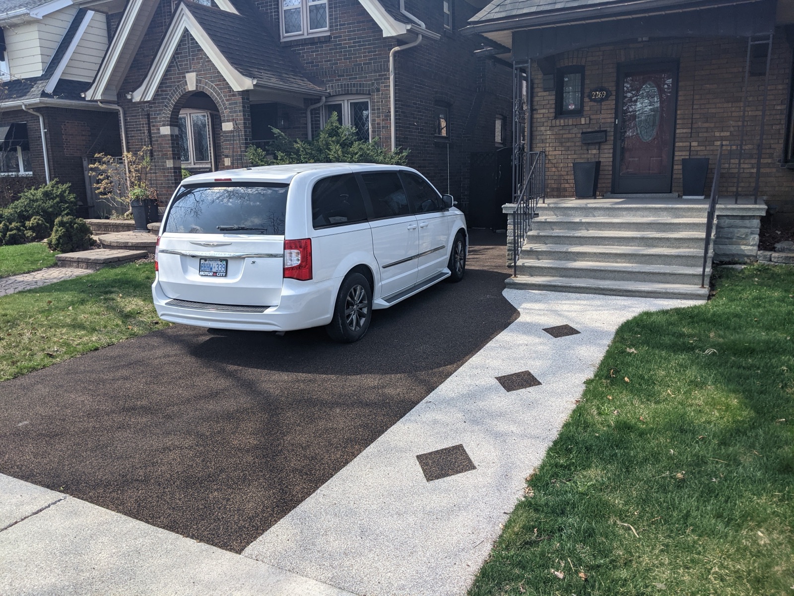 Resin-bound driveway resurfacing — black finish, GTA home
