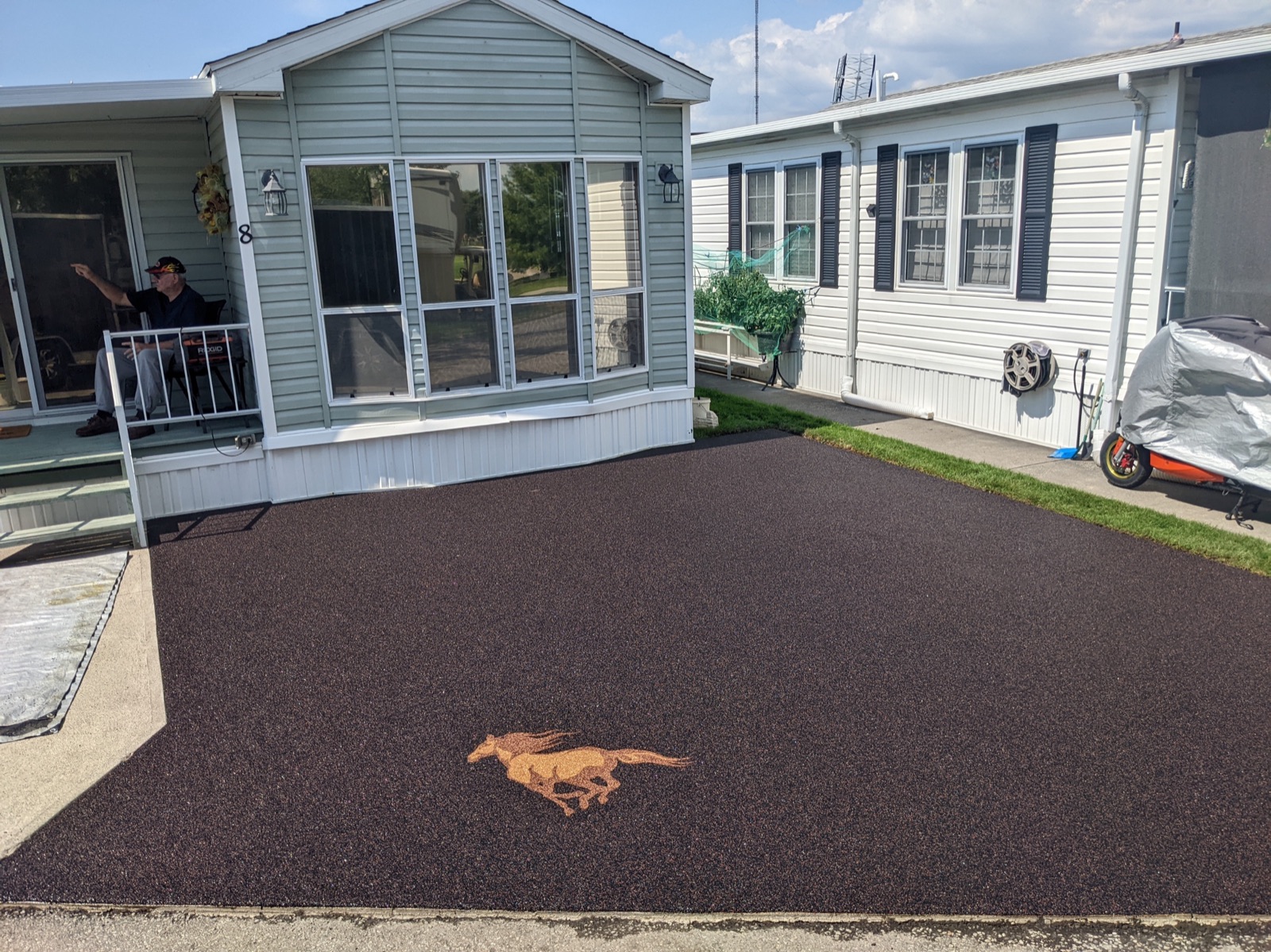 Resin-bound driveway with custom horse-logo inlay