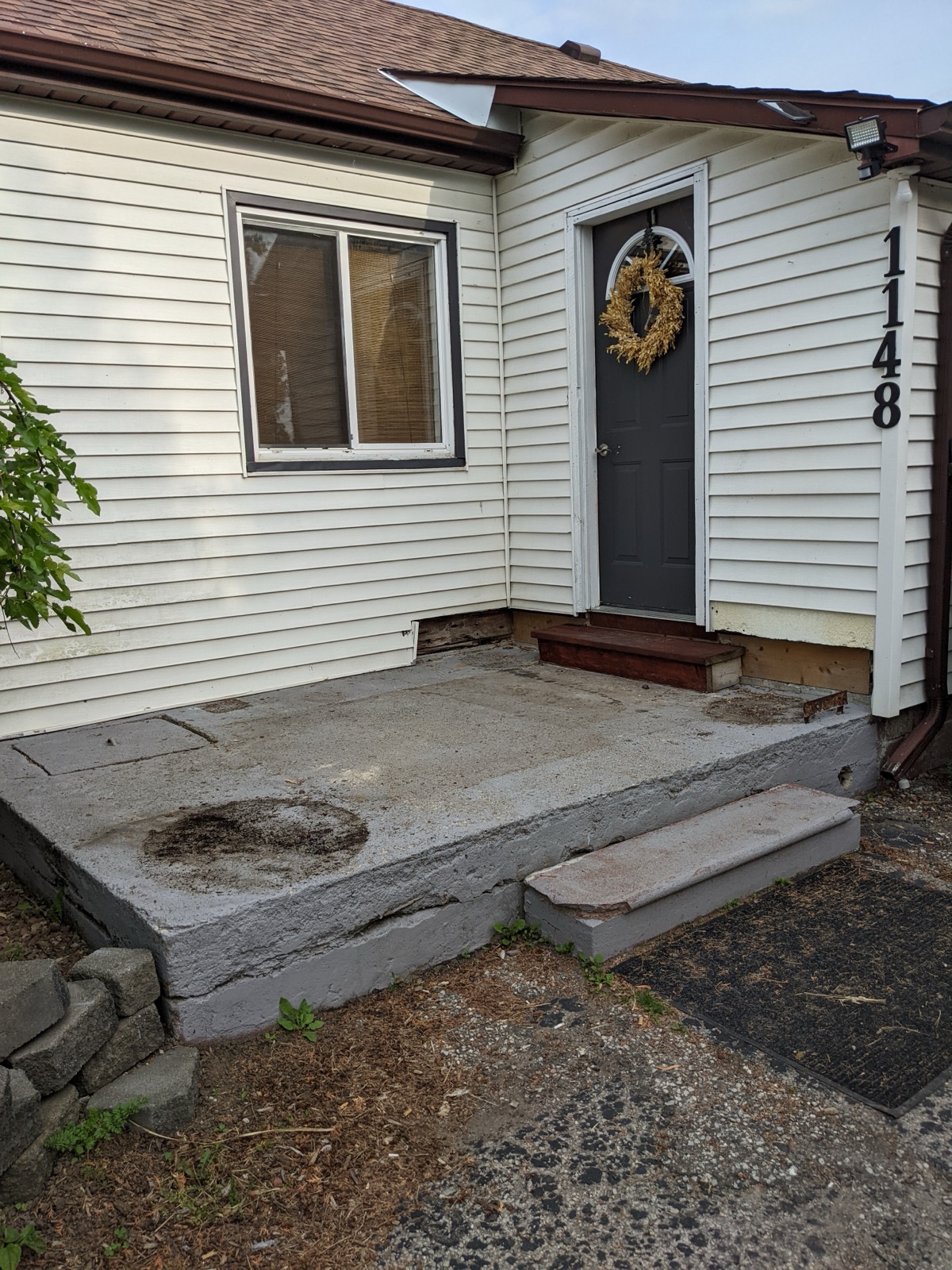 Back porch before black resin resurfacing — before