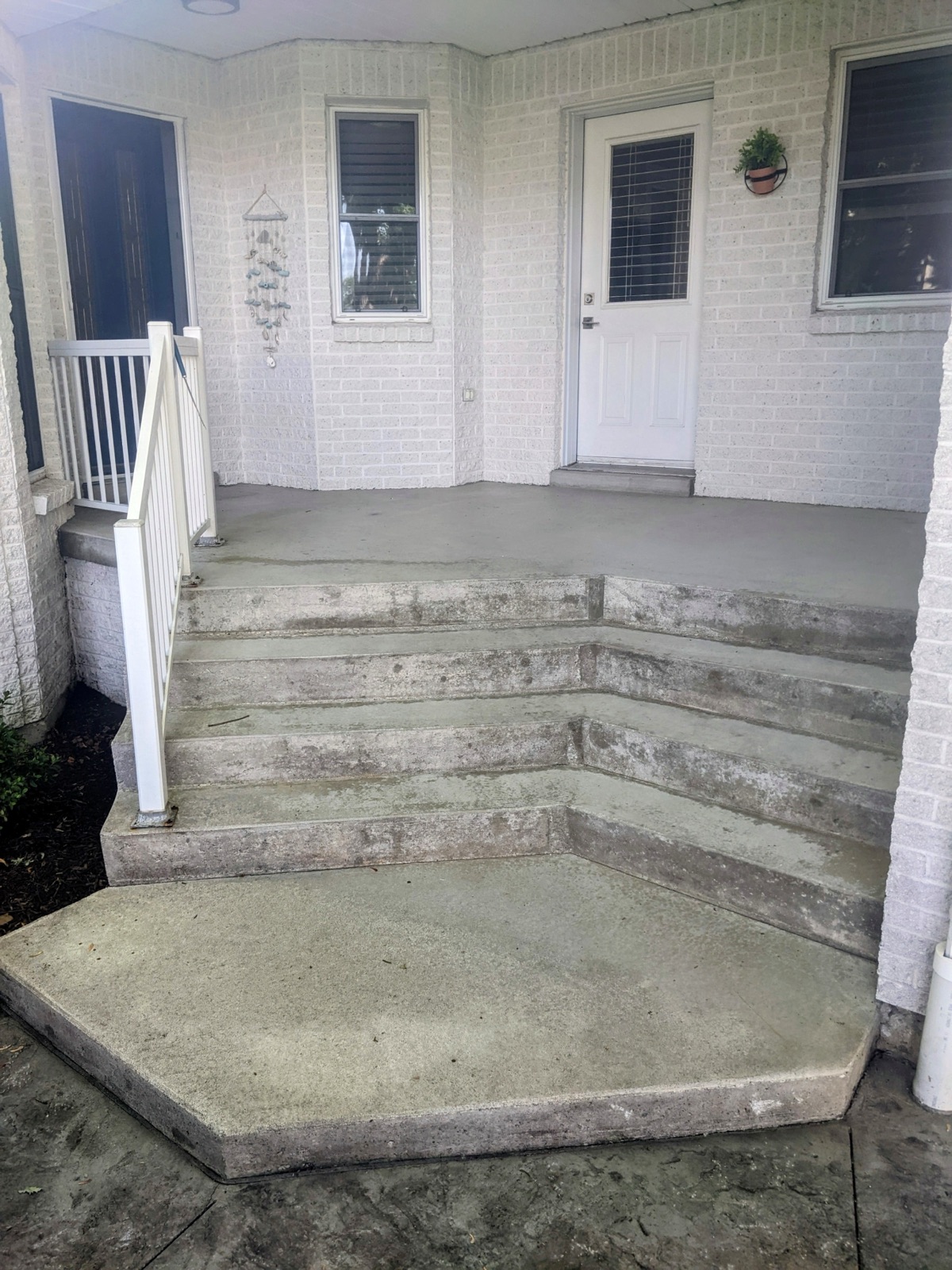 Weathered back porch before resurfacing — before