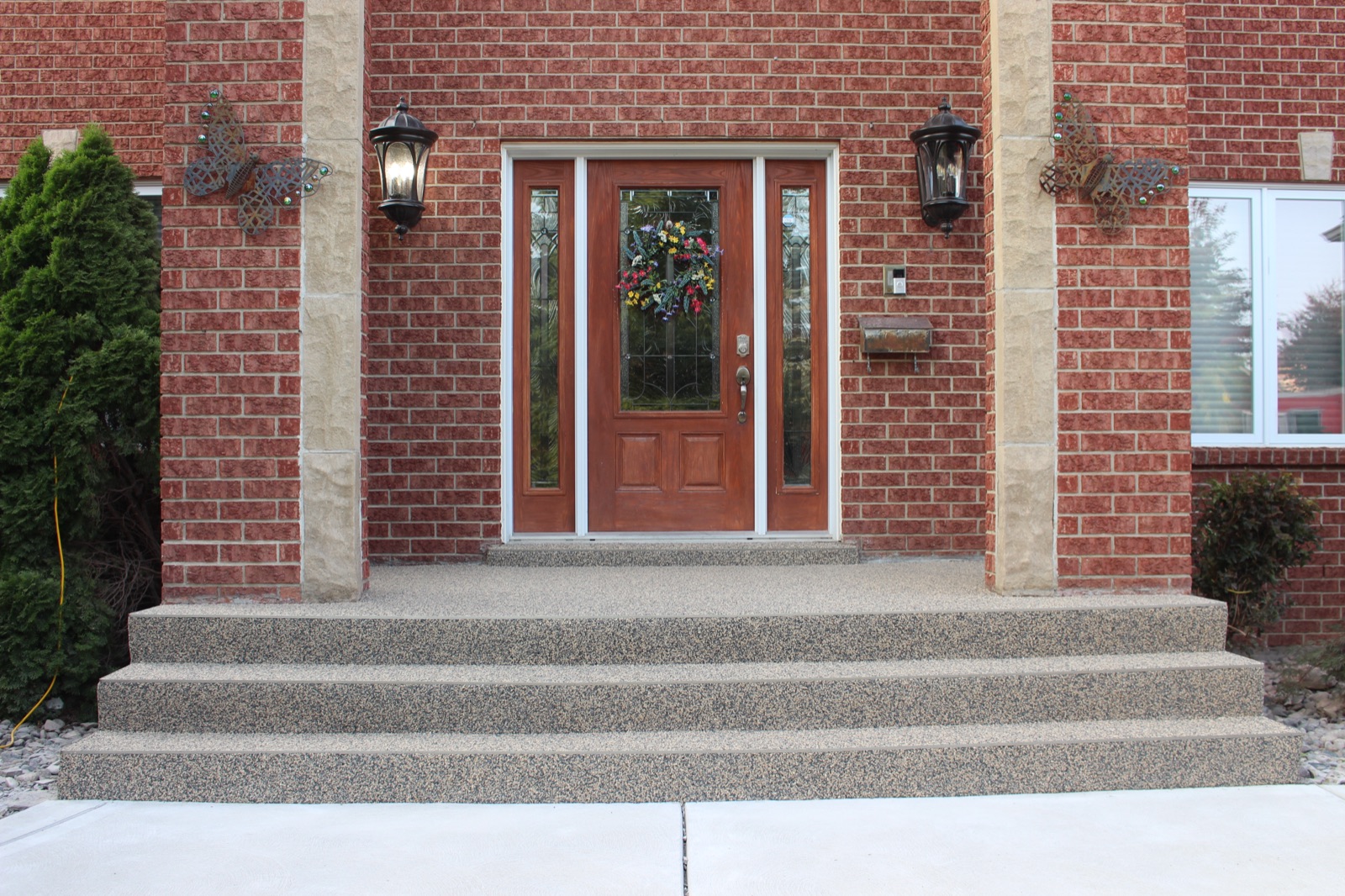 Tan resin brick entryway — after