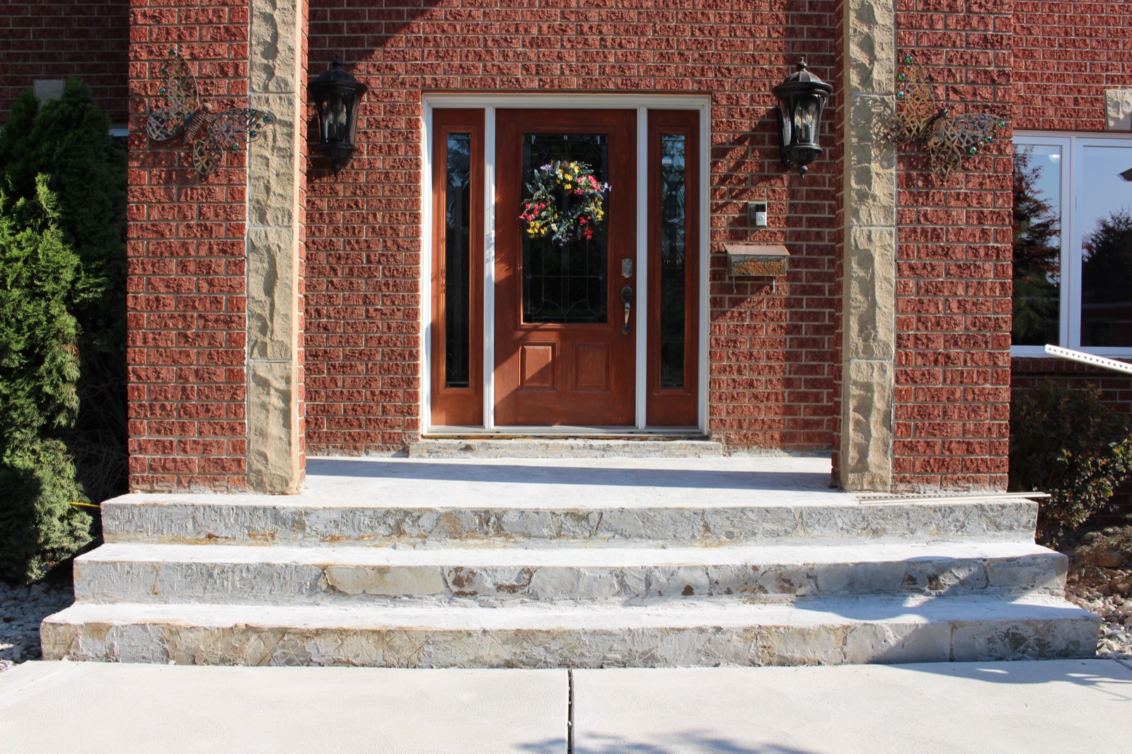 Brick entryway before tan resin resurfacing — before