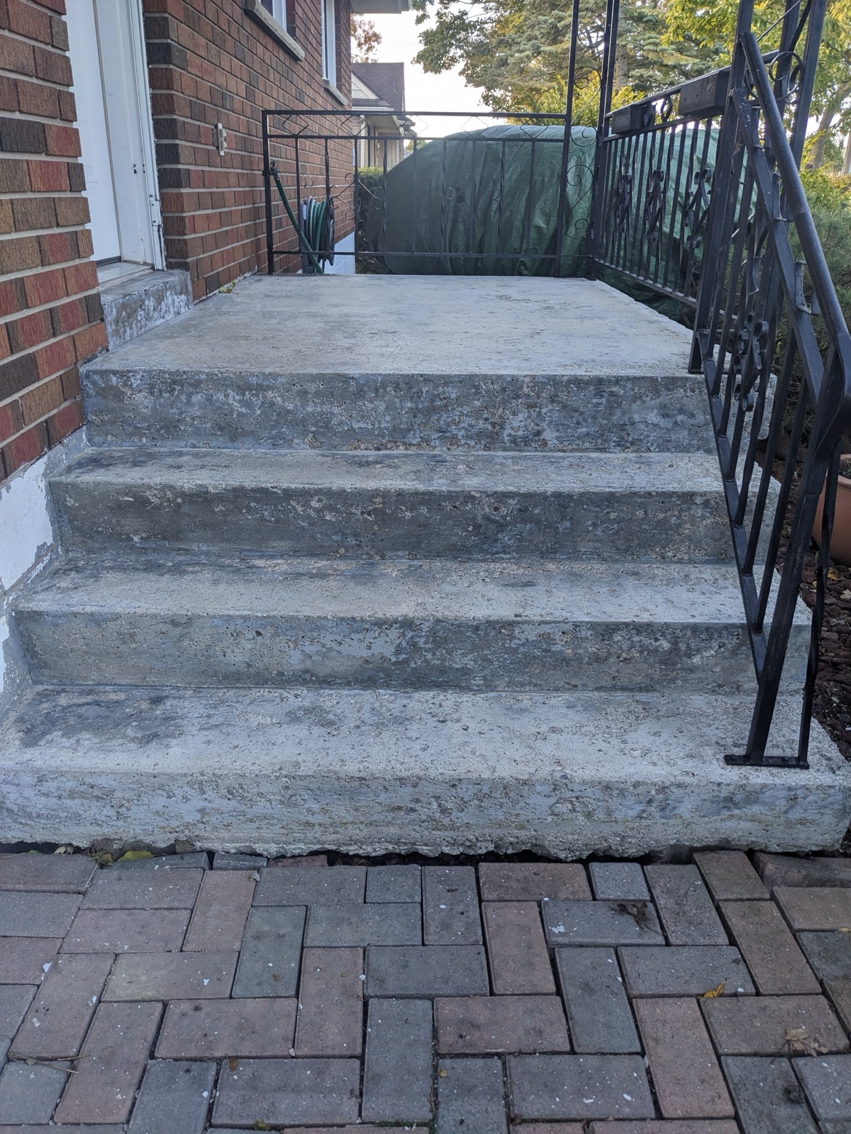 Brick pavers before dark grey resin resurfacing — before