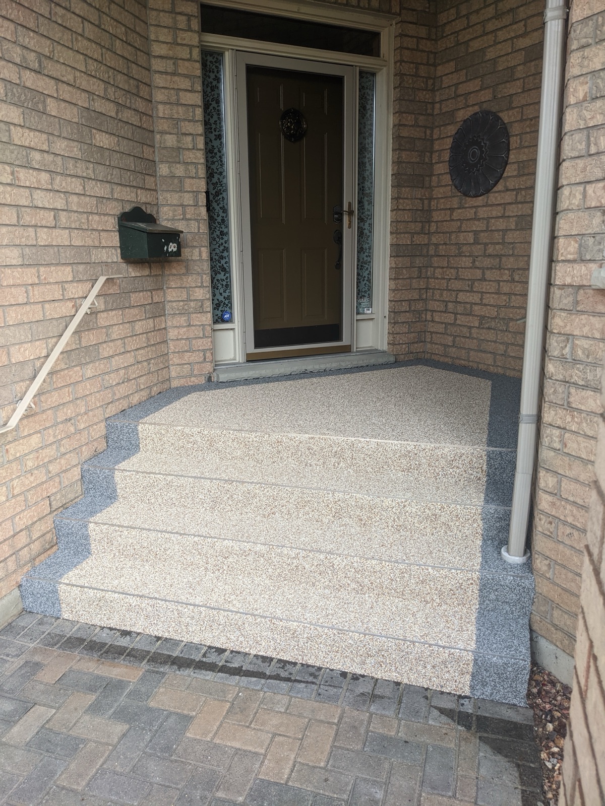 Tan front steps with grey border — after