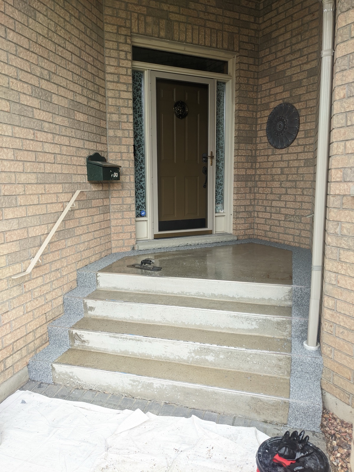 Front steps before tan and grey border resurfacing — before