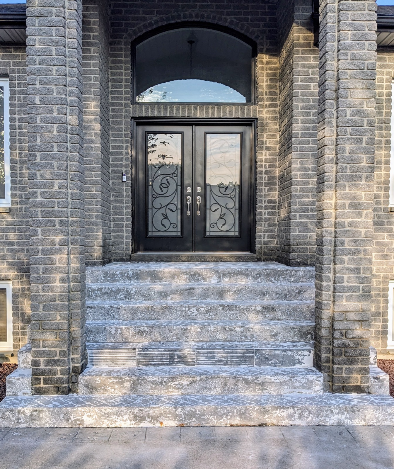 Grand double-door entry before resin resurfacing — before