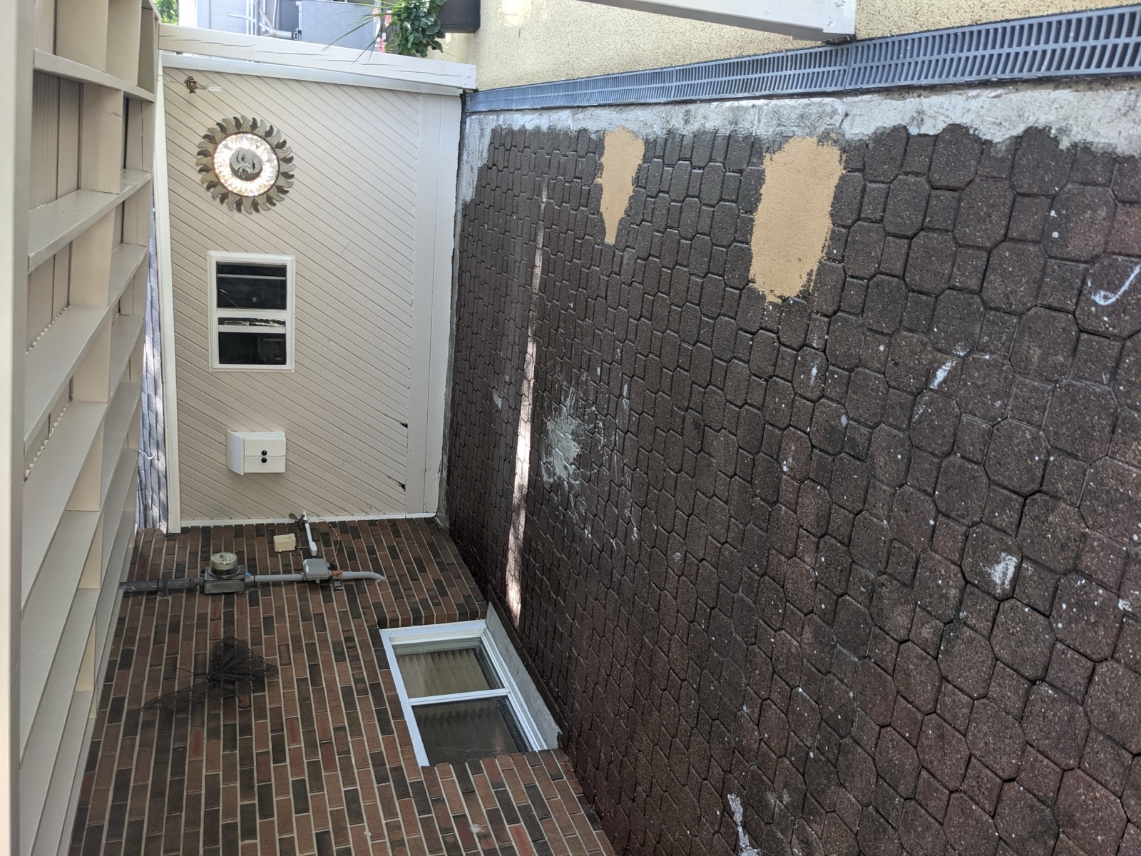 Brick pavers with puddles before permeable resurfacing — before